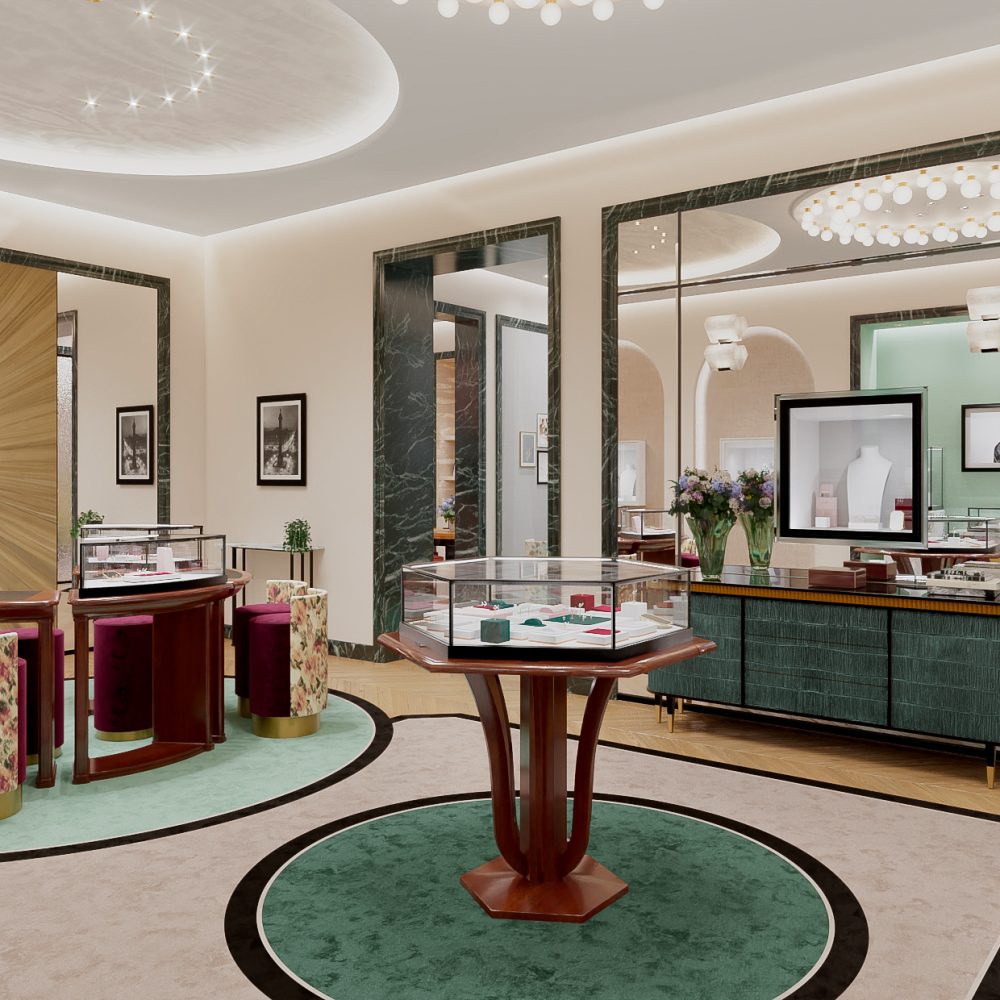 Intérieur moderne avec vitrines, tables rondes et chaises fleuries dans la boutique Boucheron de Seoul.