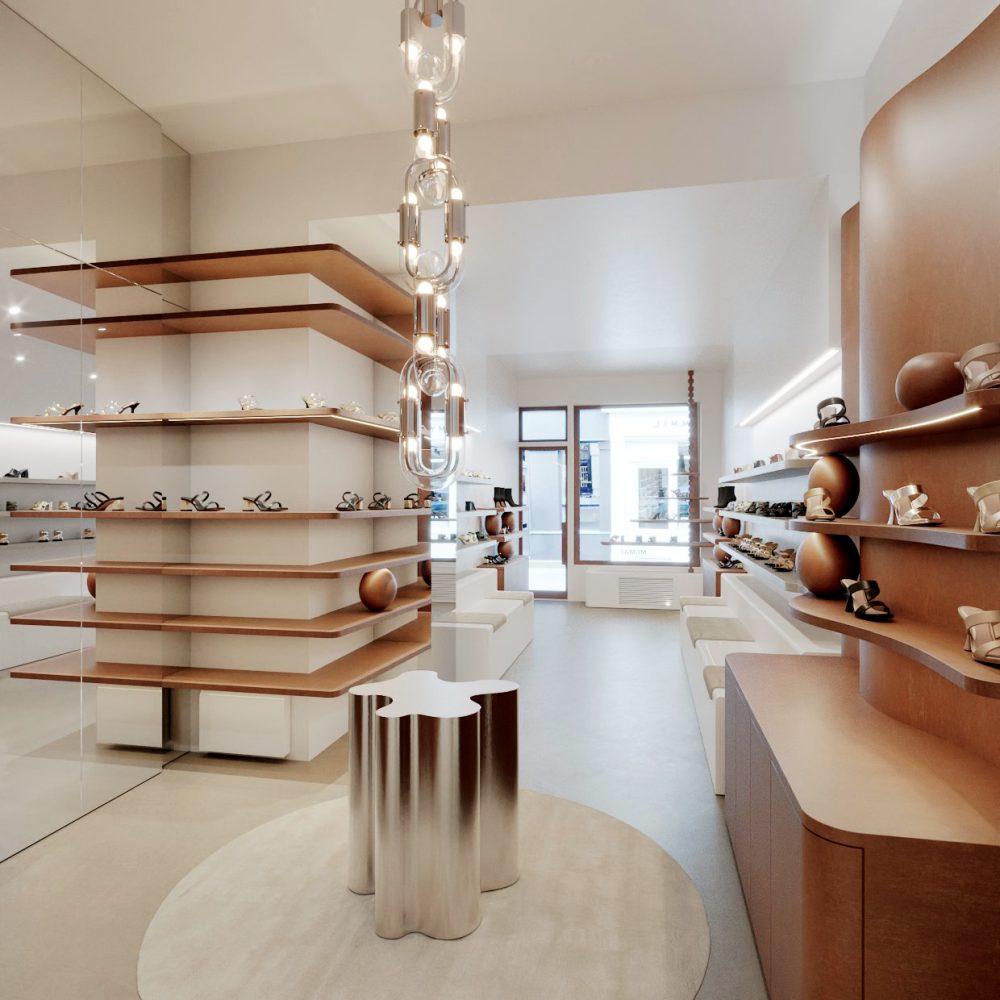 Intérieur moderne avec étagères en bois minimalistes et table métallique sculpturale Veille du Temple MAI, projet d'architecture retail de luxe.