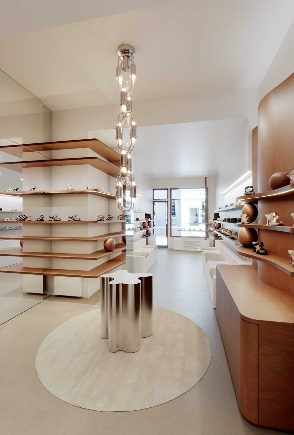 Intérieur moderne avec étagères en bois minimalistes et table métallique sculpturale Veille du Temple MAI, projet d'architecture retail de luxe.